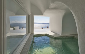 Emerald Suite with Indoor Private Hot Tub | Egyptian cotton sheets, premium bedding, memory foam beds, in-room safe - Diamond Luxury Suites Collection (Santorini)