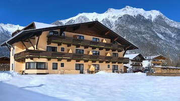 Situated in a mountainous landscape, this chalet-style hotel offers stunning views of snow-capped peaks.
