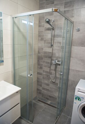 Deluxe Apartment, 1 Bedroom, Balcony | Bathroom | Shower, hair dryer, towels, soap