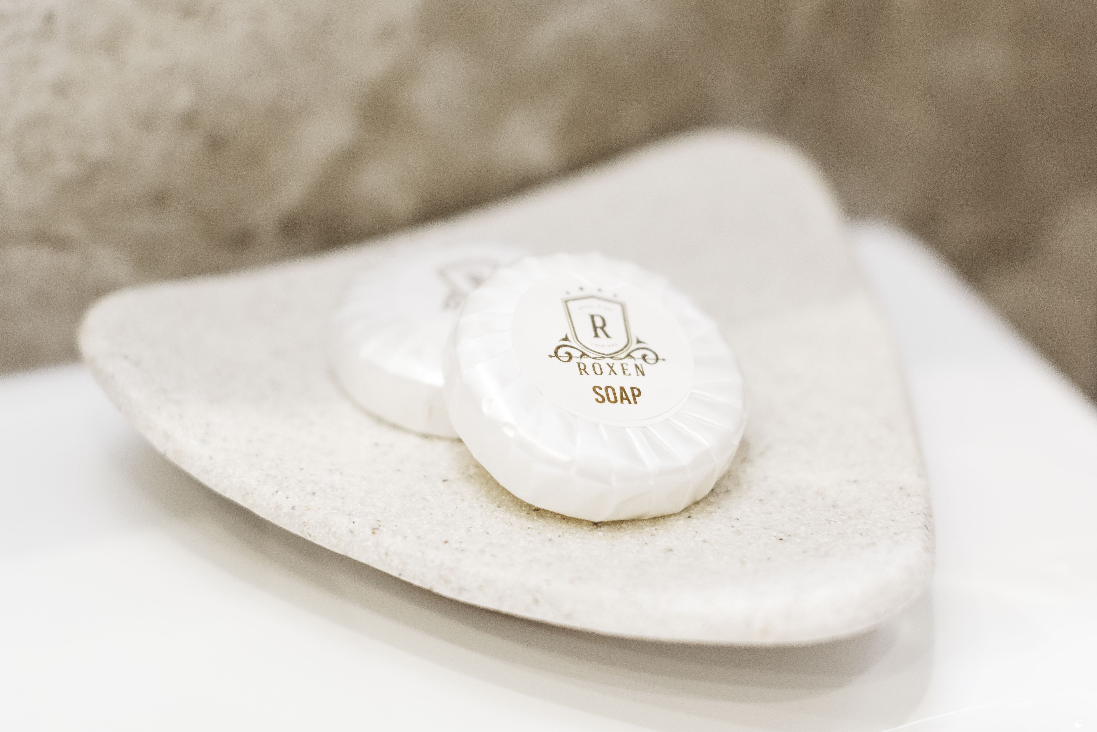 bathtub, hair dryer, slippers, towels