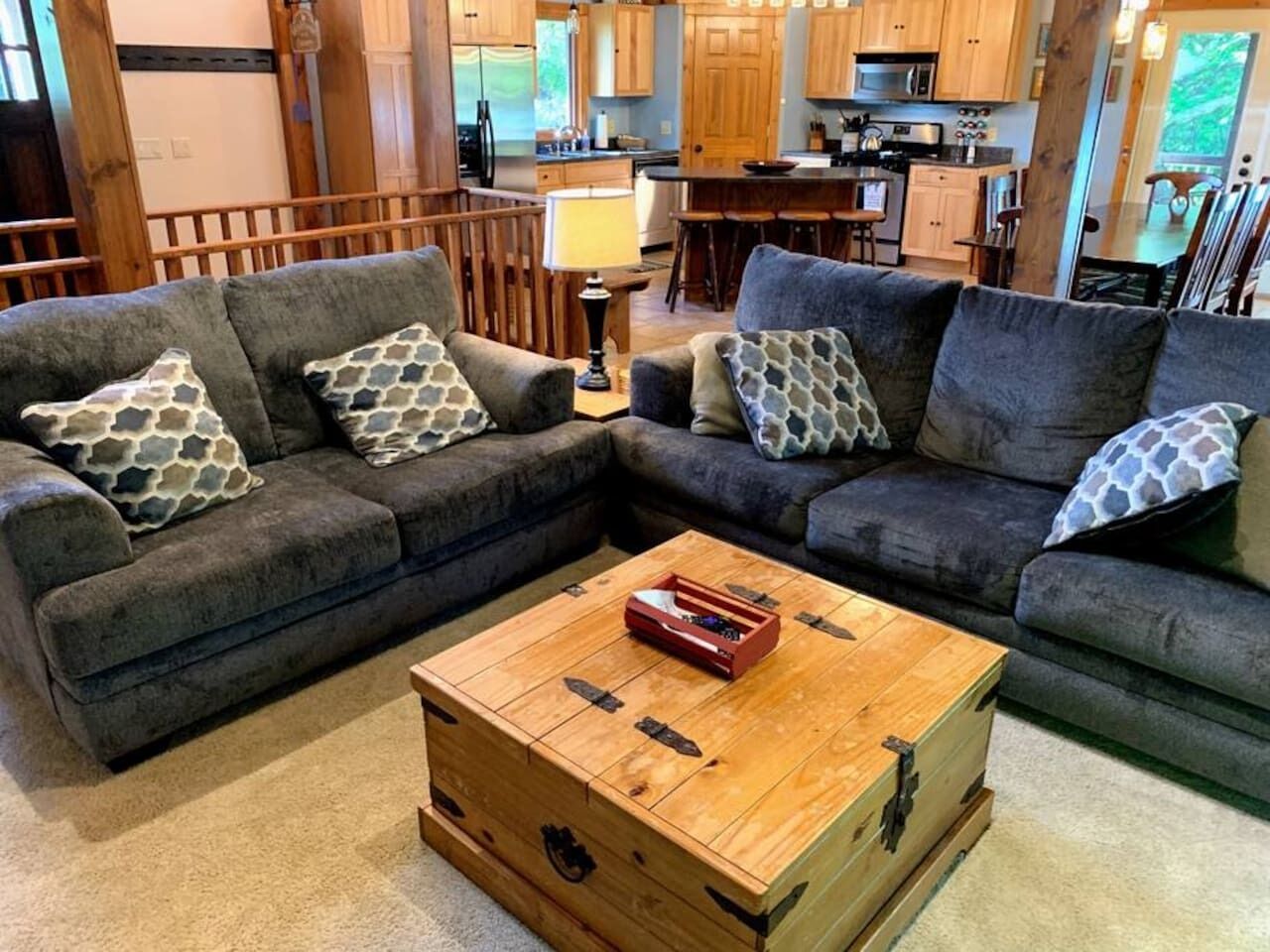 Enjoy a cozy cabin-inspired interior with natural light, exposed beams, and a queen pull-out sofa bed that makes this space perfect for larger groups.