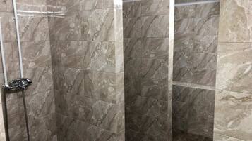 Shower, hair dryer, towels, toilet paper