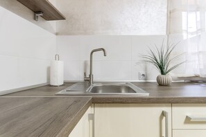Studio | Private kitchenette | Fridge, microwave, electric kettle, cookware/dishes/utensils - Vip studio apartment in the city centre (Lviv)