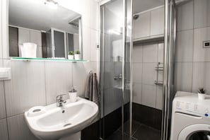 Apartment, 2 Bedrooms | Bathroom | Shower, free toiletries, hair dryer, towels
