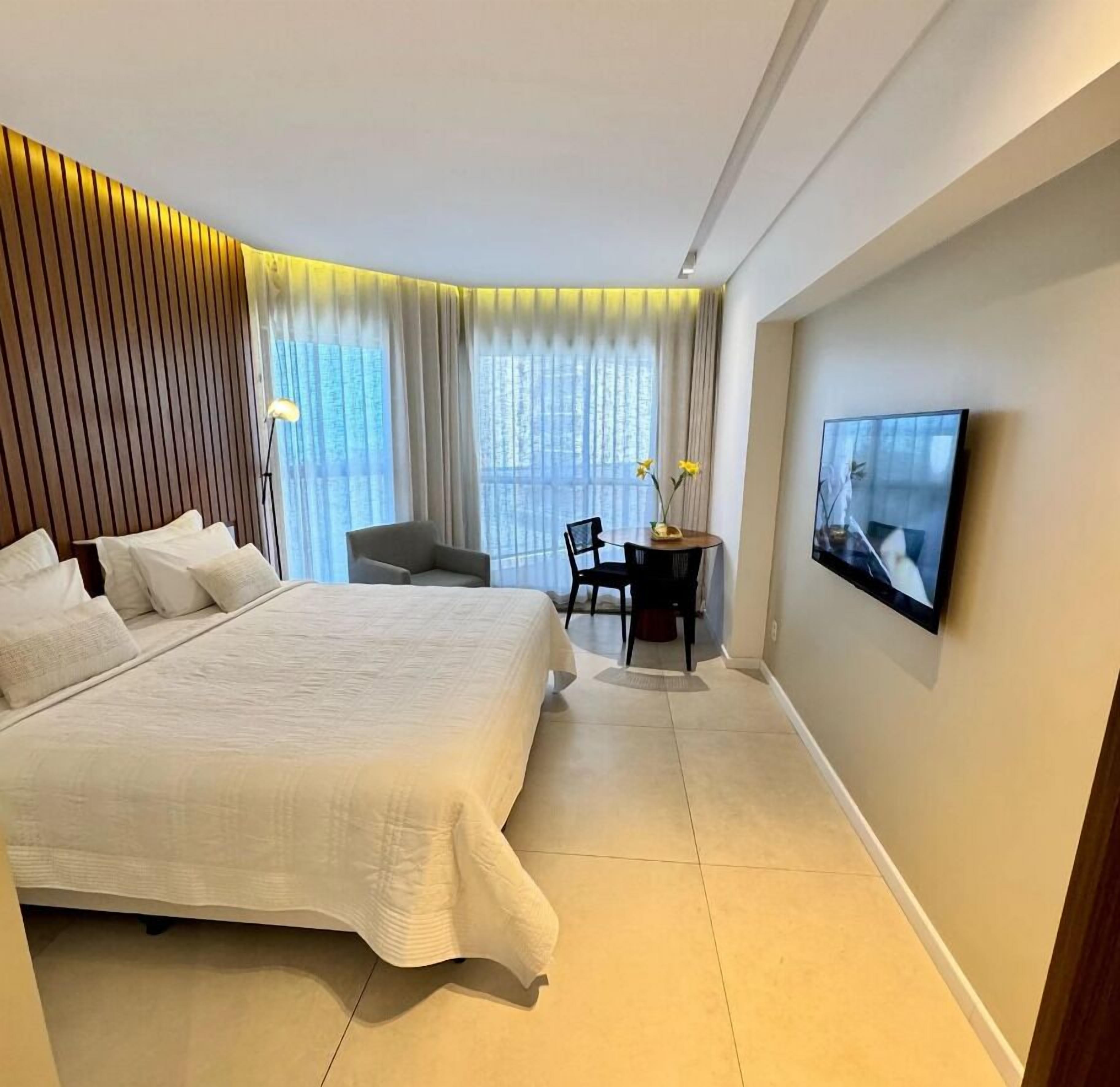 Apartamento luxo, 1 cama King e sofá-cama, vista para a praia | Cofres nos quartos, cortinas blackout, quartos à prova de som