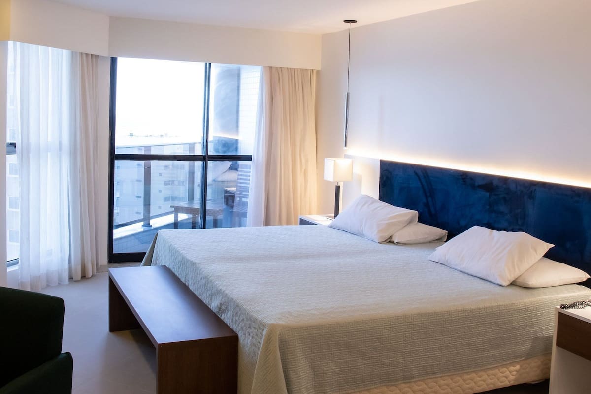 Departamento tradicional, 1 cama King size y sofá cama, Terraza, vista al mar | 1 habitación, caja de seguridad en la habitación y cortinas blackout