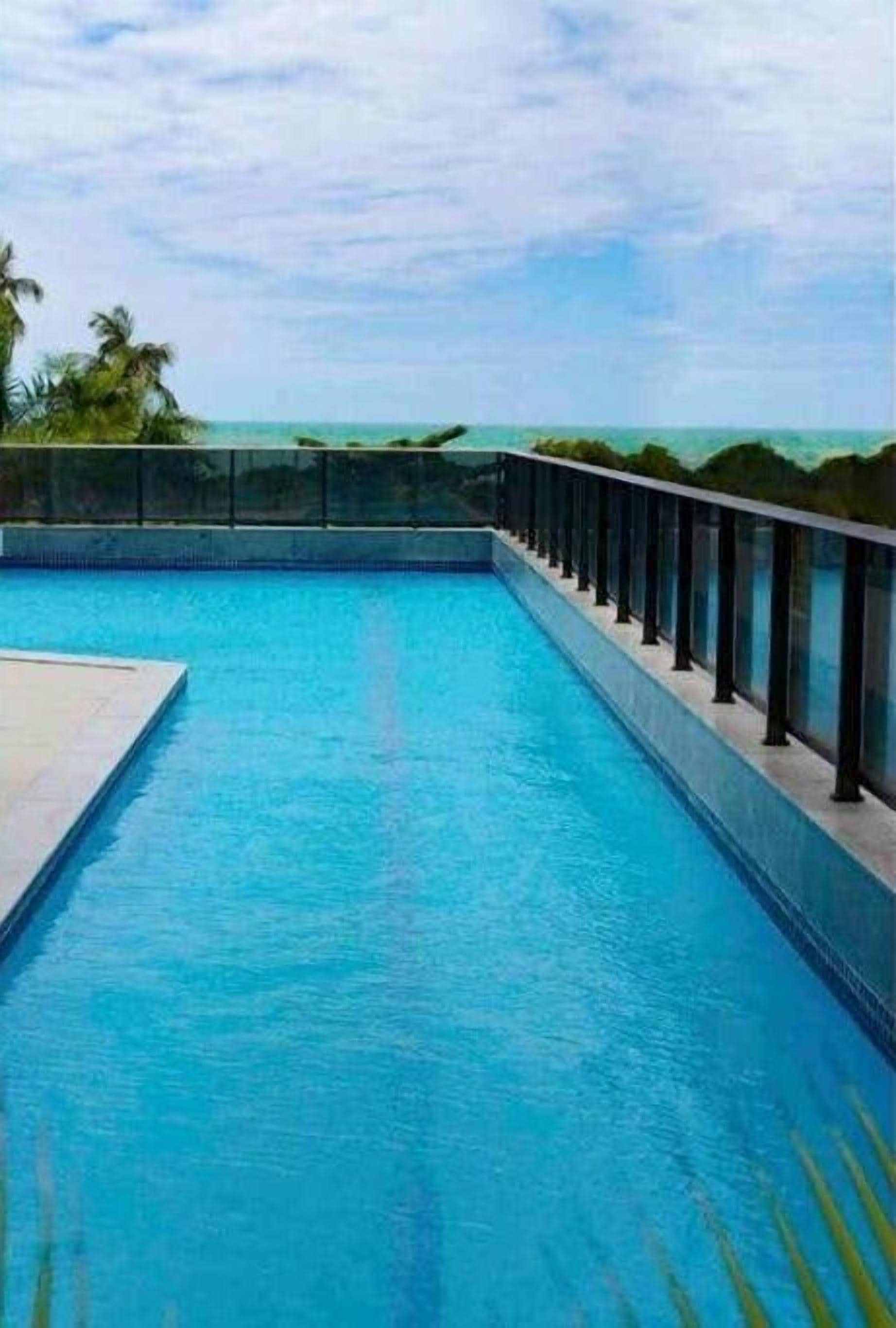 Deluxe Apartment, 1 King Bed with Sofa bed, Beach View | Pool | Outdoor pool