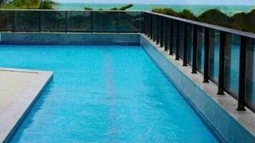 Deluxe Apartment, 1 King Bed with Sofa bed, Beach View | Pool | Outdoor pool