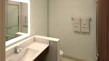 Ein Badezimmer mit Waschbecken, Spiegel, Handtuchhalter und Toilette.