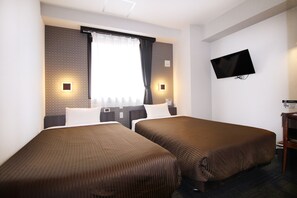 1 dormitori, escriptori i espai de treball apte per a portàtils 