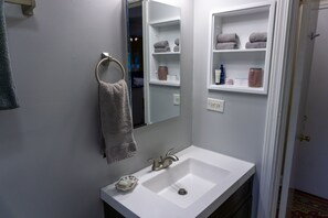 Combined shower/tub, hair dryer, towels, soap