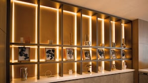 A modern reception desk with a series of illuminated panels and framed artwork. - SONO Moon Nagoya  (Nagoya)