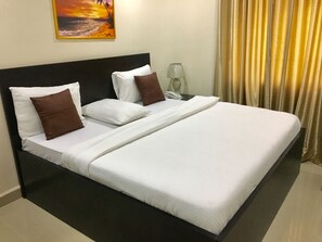 Habitación ejecutiva | Ropa de cama de alta calidad y wifi gratis 