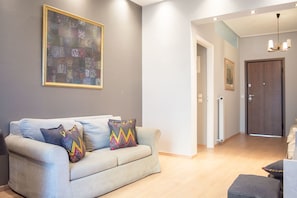 Apartamento, 1 quarto | Área de estar | TV de tela plana