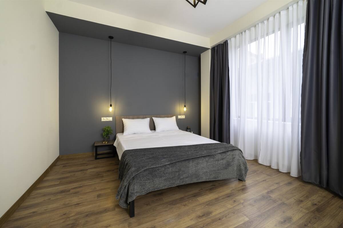 Deluxe Double Room | Hypo-allergenic bedding, desk, blackout drapes, iron/ironing board