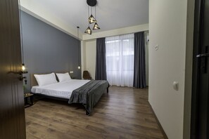 Deluxe Double Room | Hypo-allergenic bedding, desk, blackout drapes, iron/ironing board