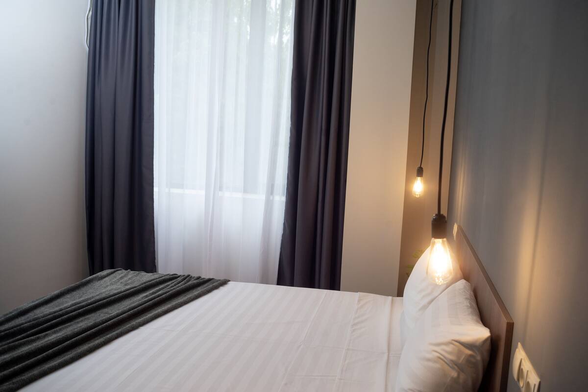 Economy Double Room | Hypo-allergenic bedding, desk, blackout drapes, iron/ironing board