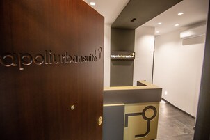 A reception area with a wooden door and a reception desk.