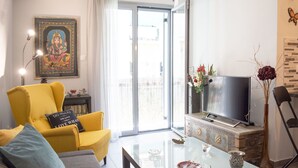 Departamento, 1 habitación | Área de sala de estar | Televisión de pantalla plana 
