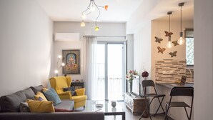 Departamento, 1 habitación | Área de sala de estar | Televisión de pantalla plana 