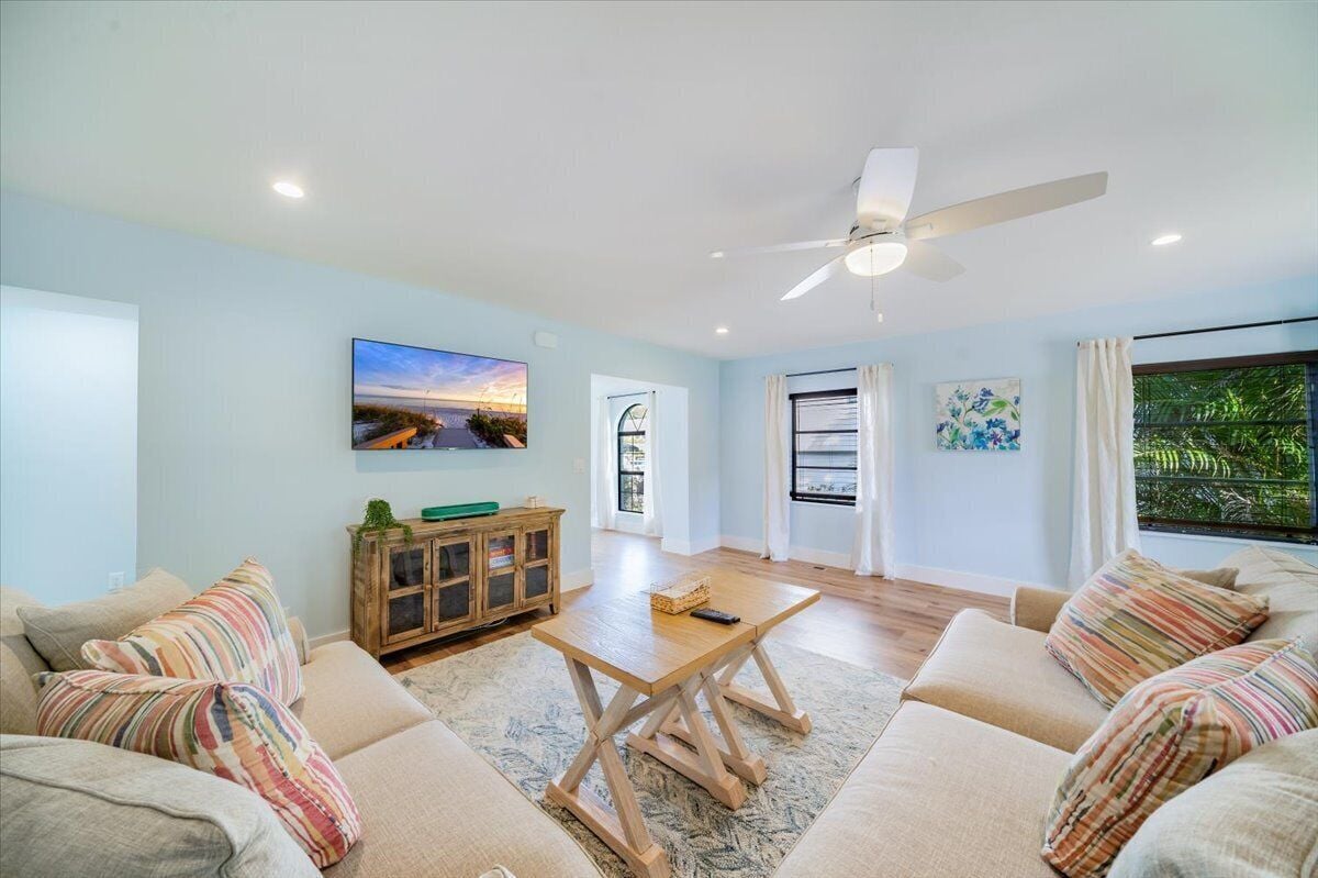 Photo 7 of Adorable canal front cottage close to beach with boat ramp, dock & heated pool.