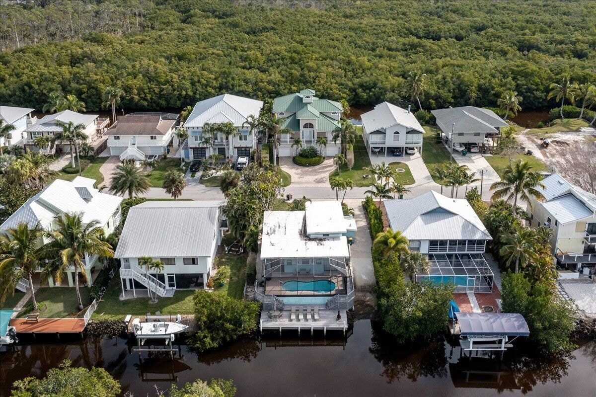 Photo 29 of Adorable canal front cottage close to beach with boat ramp, dock & heated pool.