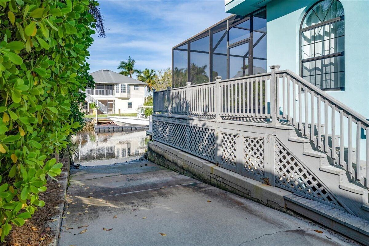 Photo 23 of Adorable canal front cottage close to beach with boat ramp, dock & heated pool.