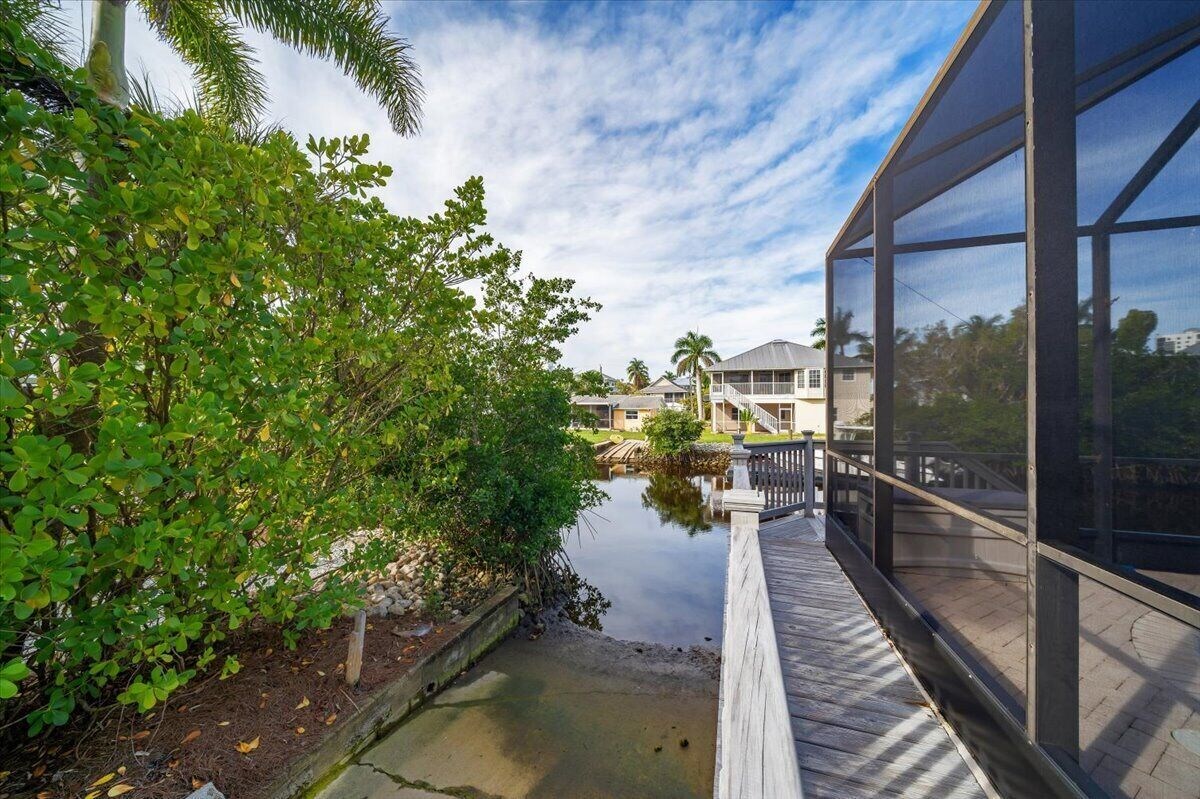Photo 22 of Adorable canal front cottage close to beach with boat ramp, dock & heated pool.