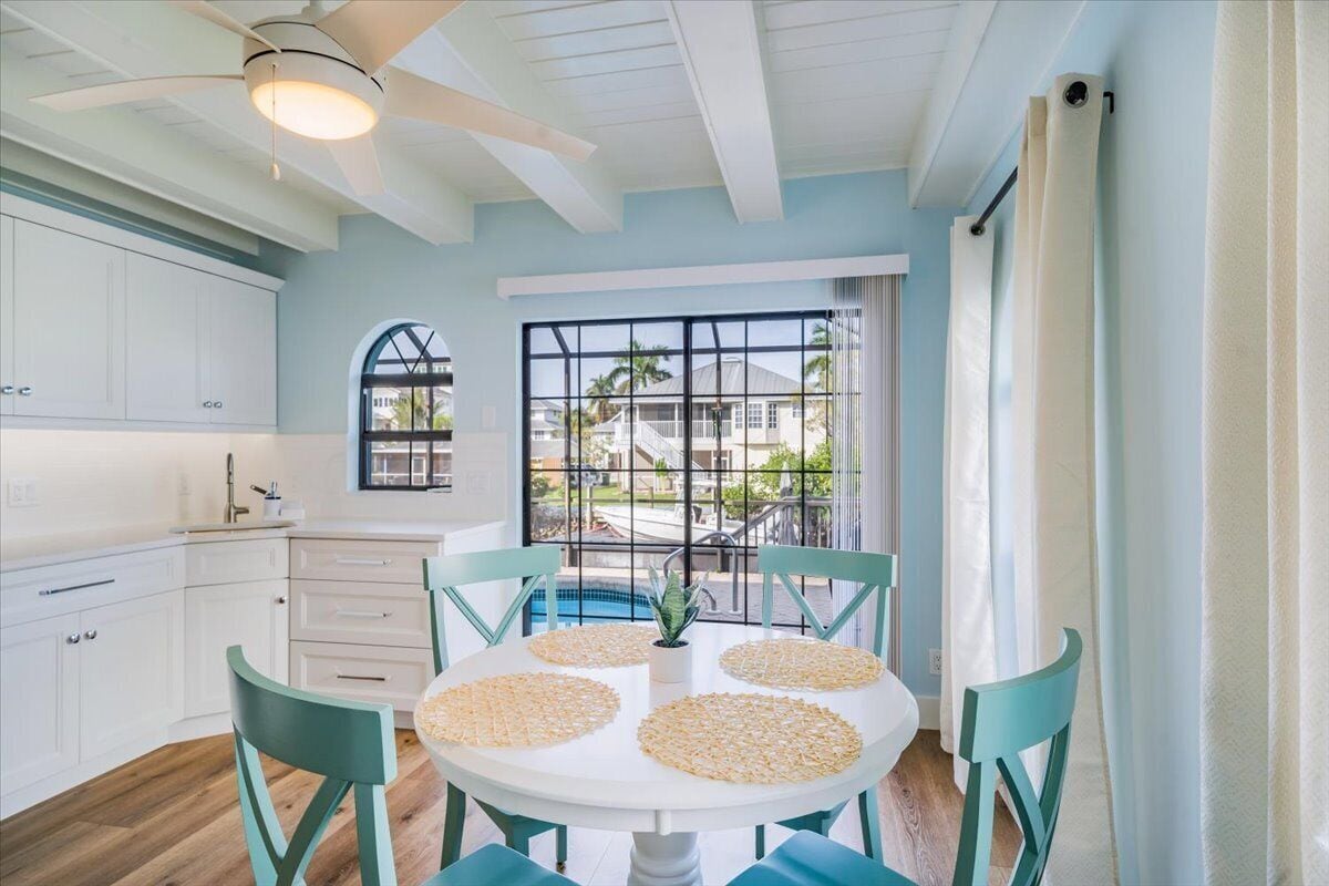 Photo 10 of Adorable canal front cottage close to beach with boat ramp, dock & heated pool.