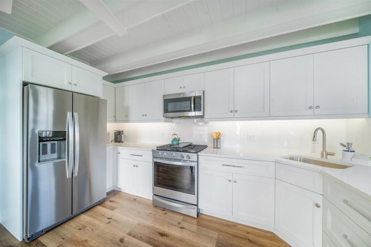 Photo 11 of Adorable canal front cottage close to beach with boat ramp, dock & heated pool.