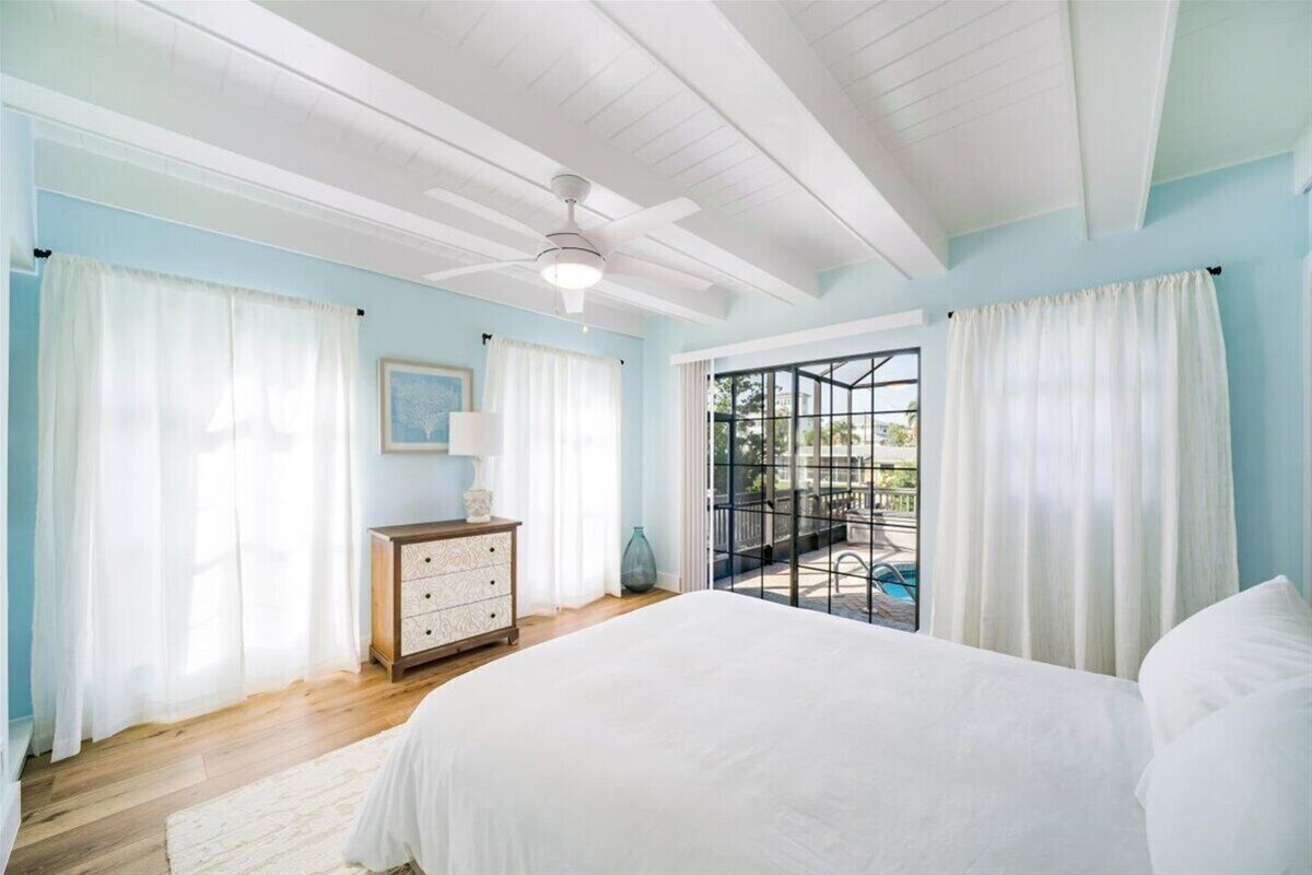 Photo 12 of Adorable canal front cottage close to beach with boat ramp, dock & heated pool.