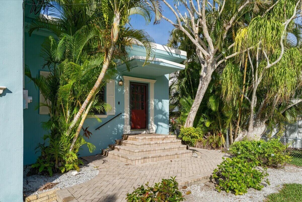 Photo 21 of Adorable canal front cottage close to beach with boat ramp, dock & heated pool.