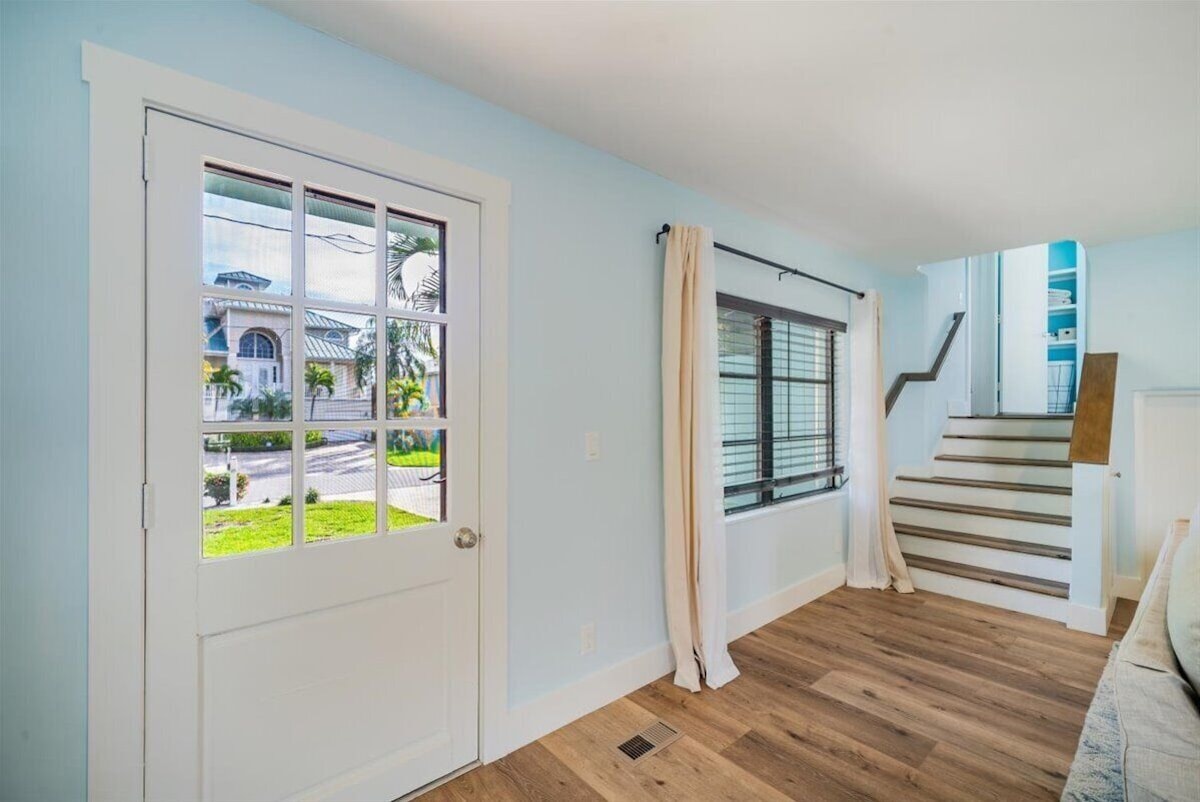 Photo 6 of Adorable canal front cottage close to beach with boat ramp, dock & heated pool.
