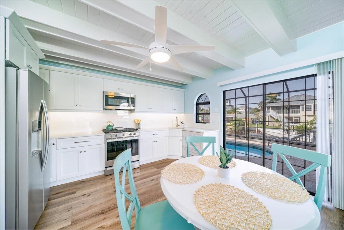 Photo 9 of Adorable canal front cottage close to beach with boat ramp, dock & heated pool.
