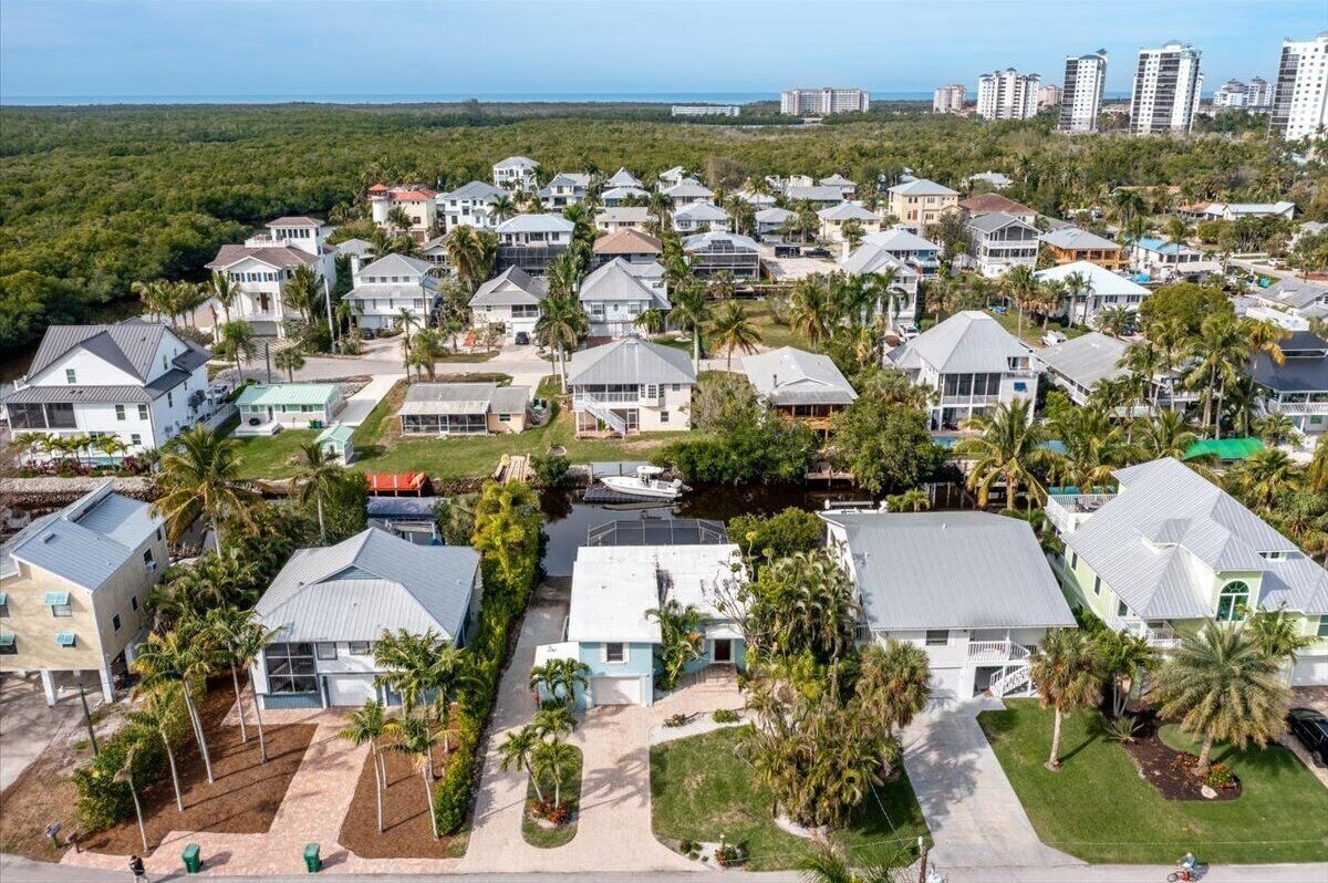 Photo 27 of Adorable canal front cottage close to beach with boat ramp, dock & heated pool.