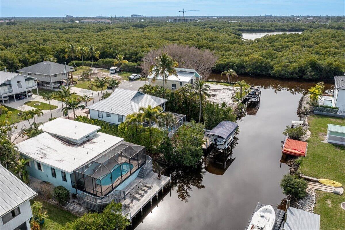 Photo 31 of Adorable canal front cottage close to beach with boat ramp, dock & heated pool.