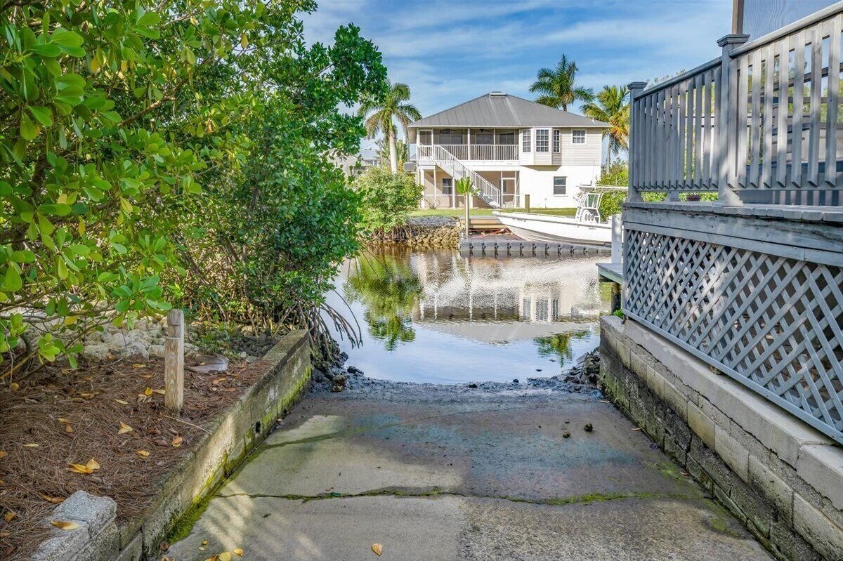 Photo 33 of Adorable canal front cottage close to beach with boat ramp, dock & heated pool.