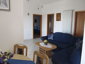 Apartment, 3 Bedrooms | Living area | Flat-screen TV