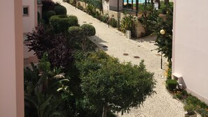 A resort with multiple buildings, a paved walkway, and a pool area. - SAINT JAMES - APT SEA VIEW - 2 / 4PERS (Luz)