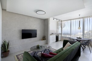 Deluxe Apartment | Living area | 40-inch Smart TV with digital channels, TV, Netflix