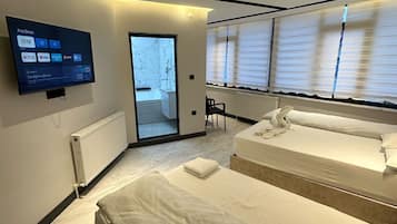 Family Room, 2 Bedrooms, City View | Desk, laptop workspace, soundproofing, free WiFi