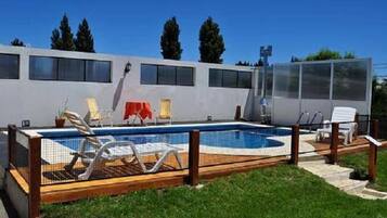 Seasonal outdoor pool, open 11:00 AM to 8:30 PM, pool umbrellas