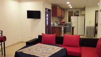 Apartemen | Area keluarga | TV layar datar