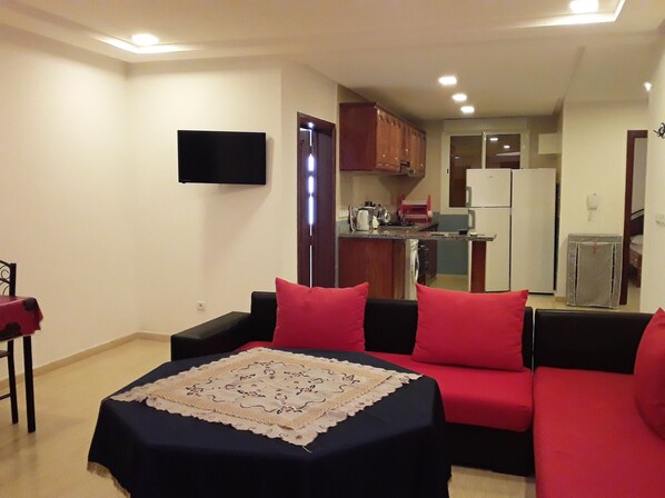Apartment | Living area | Flat-screen TV - Résidence Mers Beach Appart Vue Piscine (Moulay Abdallah)