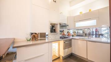 Fridge, microwave, stovetop, coffee/tea maker