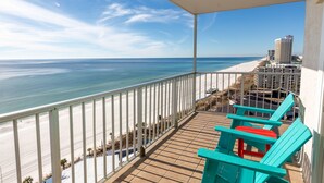 A balcony with a view of the beach and ocean. - Summit 2BR 2BA 13th Floor End Unit w/ BEACH CHAIRS INCL!!! (Panama City Beach)