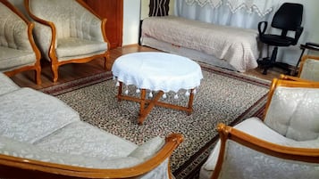 Grand Apartment, 3 Bedrooms, City View | Living room | TV