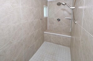 Bathtub, hair dryer, towels, soap