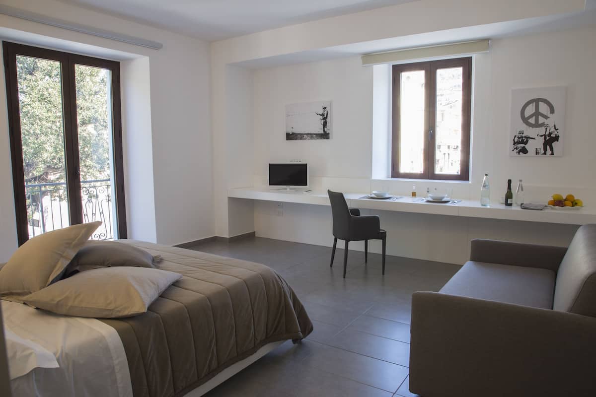 City Studio Suite, 1 Queen Bed with Sofa bed, City View | Premium bedding, down duvets, memory-foam beds, minibar