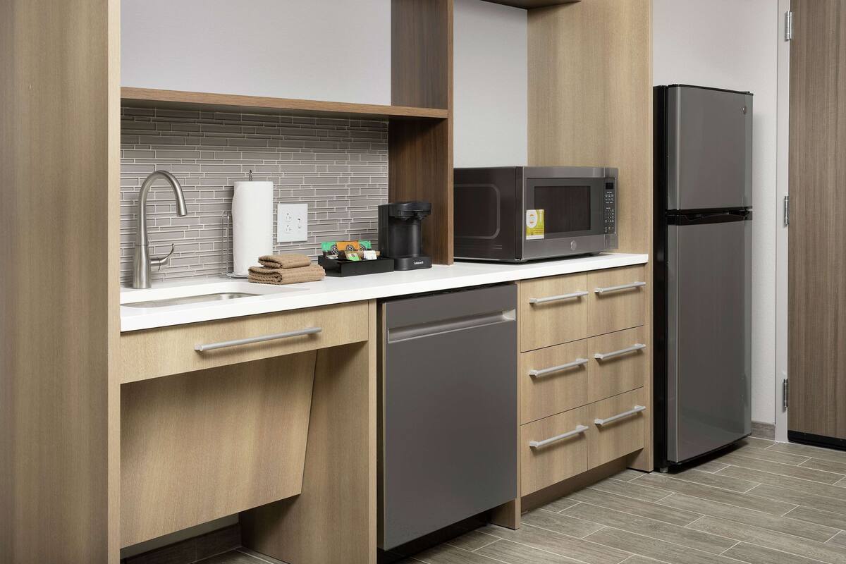 full-sized fridge, microwave, dishwasher, coffee/tea maker